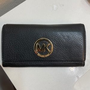 Michael Kors Wallet.  Been used a couple times.